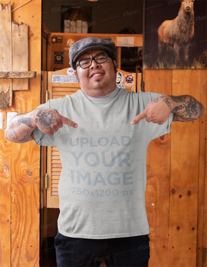 Mockup of a Man Pointing at His T-Shirt